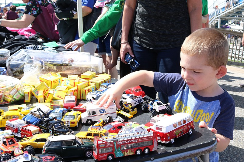 Travis Delsignore, 2, of Delaware, checks out the wheels