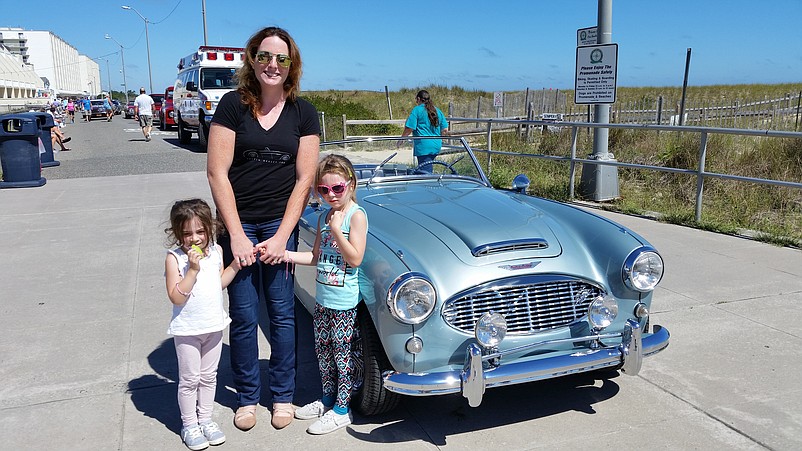 Pamela Fine, of Cape May Court House, gets ready to take her daughters, Penelope, 4, and Avery, 6, for a ride in her 1957 Austin-Healey Model 100-6, the vintage car named "Mayor's Choice" in the show.