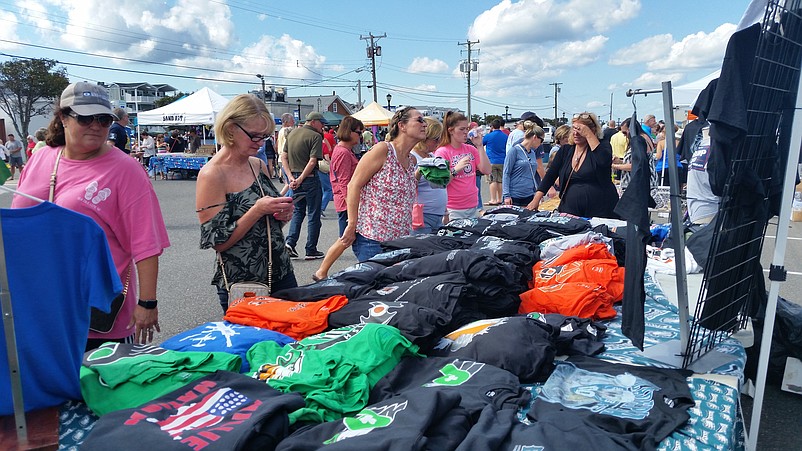 Festival-goers browse at one of Harborfest's clothing vendors.