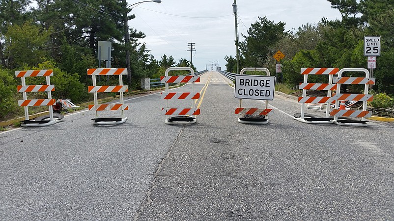 Motorists are greeted by a "Bridge Closed" sign and barriers at the foot of the Townsends Inlet Bridge during its reconstruction.