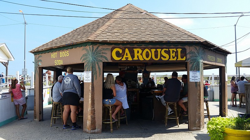 Customers can have drinks under the Carousel's tiki hut-style bar.