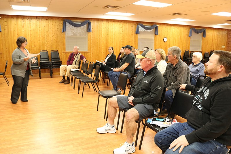 The audience listens to Municipal Alliance Coordinator Kellie Seib talk about the important of Narcan training.