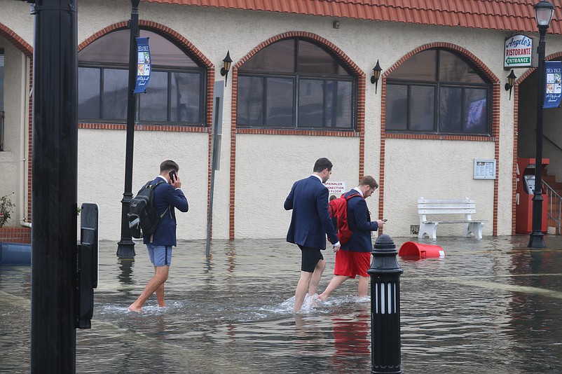 A coastal storm in October 2018 swamped Sea Isle's streets, forcing three members of a wedding party to roll up their pants while wading through the water on Landis Avenue on their way to St. Joseph Catholic Church.