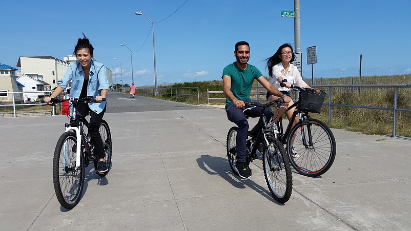 Bicyclists take advantage of the nice weather for a ride on the Sea Isle Promenade.