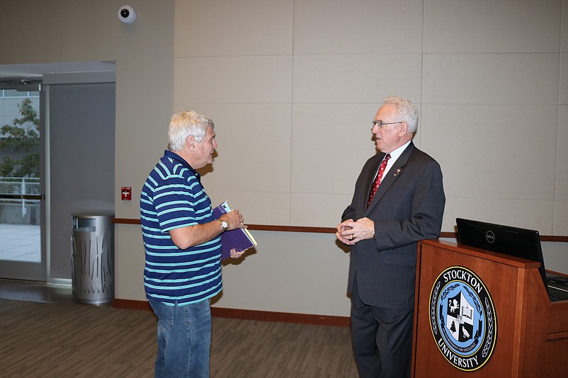 Jeff Schenker, left, a Toms River resident and vice president of the Ocean City Historical Society, talks with Pierson after the presentation.