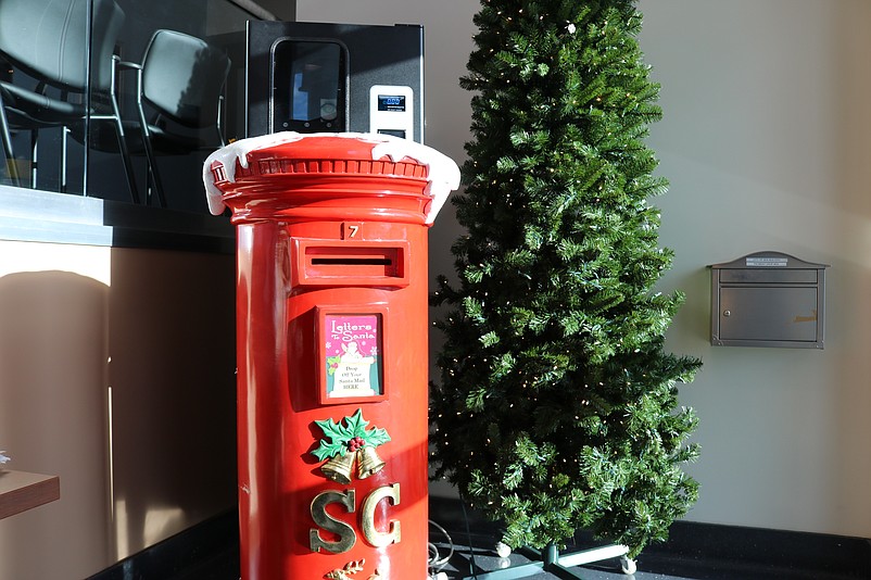 Santa's personalized shiny red mailbox in City Hall allows children to mail their Christmas letters directly to the North Pole.