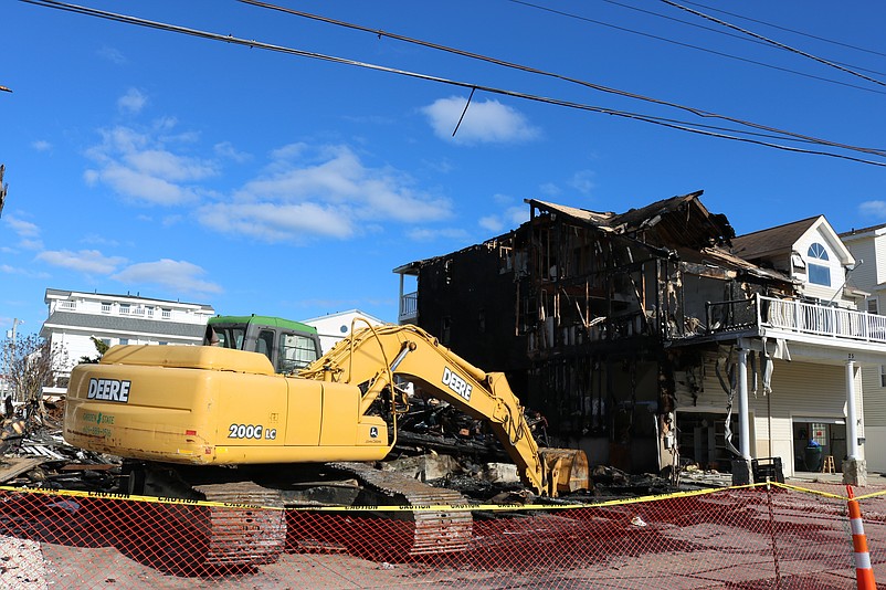 The duplex on the ocean side, at right, of the destroyed home was also badly damaged and it has not yet been announced whether it can be saved.