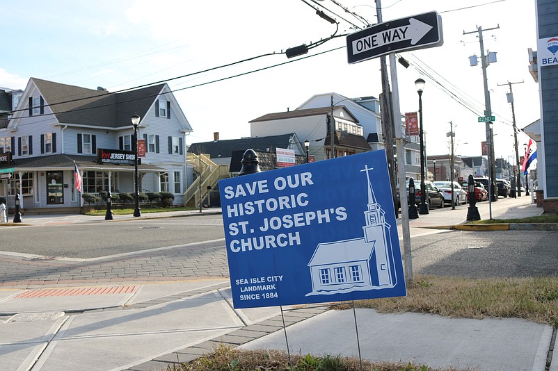 Signs in favor of saving the old church are scattered throughout Sea Isle City.