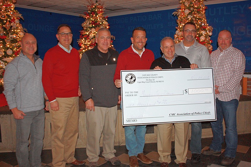 The Cape May County Association of Chiefs of Police donated toys and a check for $1,000 to Mayor Leonard Desiderio’s 26th Annual Holiday Toy and Food Drive. From left, are New Brunswick Police Director Tony Caputo, Cape May County Prosecutor Jeffrey Sutherland, Cape May County Police Academy Director Tom DePaul, Wildwood Police Chief and President of CMC Association of Chiefs of Police Robert Regalbuto, Mayor Leonard Desiderio, former Sea Isle City Police Chief Thomas D’Intino and Sea Isle City Police Chief Thomas McQuillen.