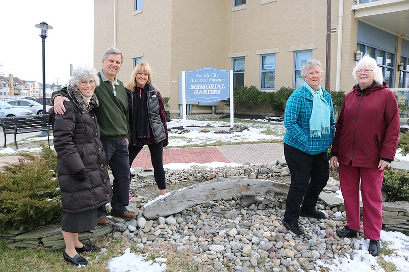 In a photo from 2019, Sea Isle City Historical Society and Museum members Lynne Shirk, Ron Kovatis, Abby Powell, Arlene McFadden and Anne Organ stand next to what is believed to be a piece of a shipwreck on display at the Memorial Garden.