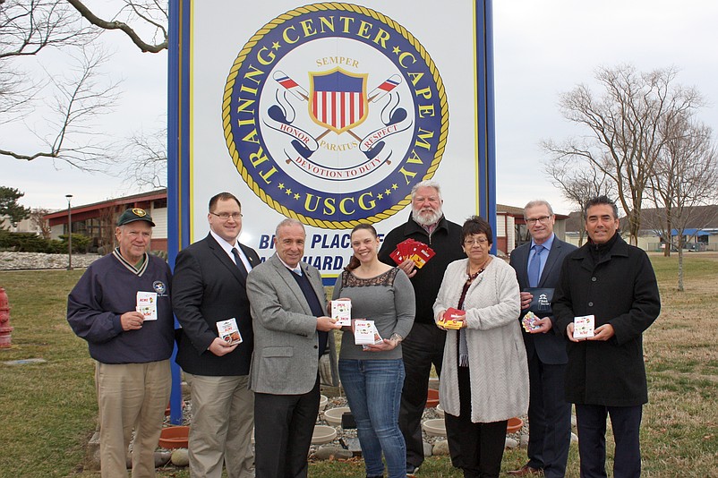 Coast Guard Chief Petty Officer Kellie Dean, center, accepts donations from (left to right) Sea Isle Councilman Bill Kehner, Sen. Bob Andrzejczak, Sea Isle Mayor Leonard Desiderio, First Bank Board Member Dave Beyel, First Bank Vice-President Julie Miner, First Bank President/CEO Larry Schmidt and First Bank Board Member Joe Romano Jr. 