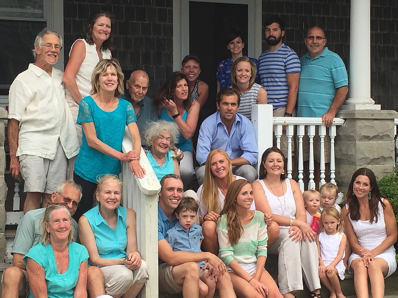 In a happier time, the Hall family posed for a group photo on the home's wraparound porch. (Photo courtesy of Susan Hall-Pinzini)