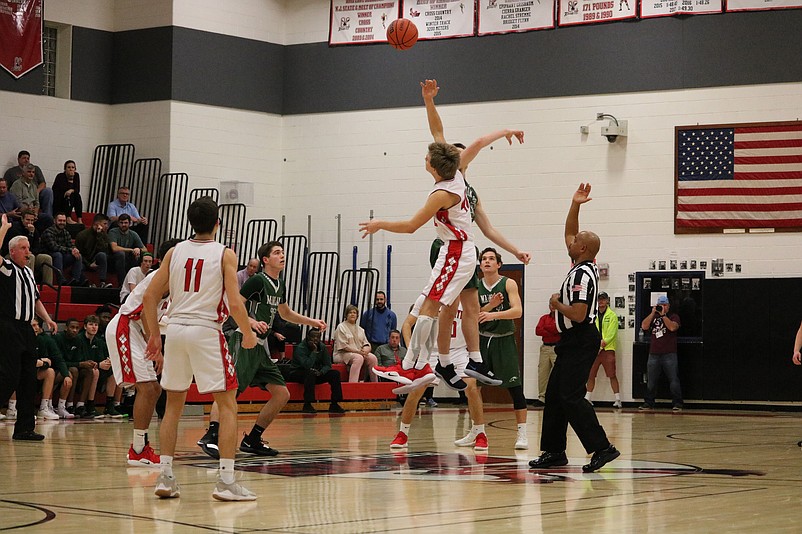 Ocean City wins the jump ball against Mainland and goes on for the victory.