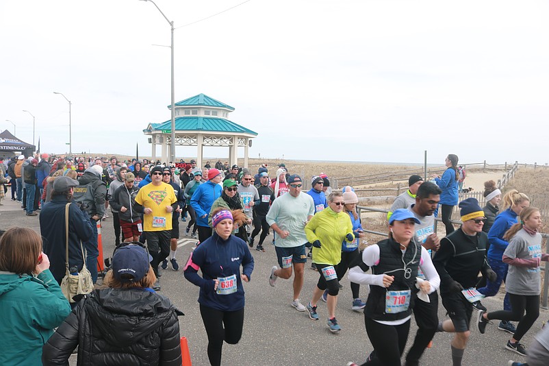 Runners take off at the start of the Mike's Seafood Polar Bear Run-Walk for Autism in 2019.