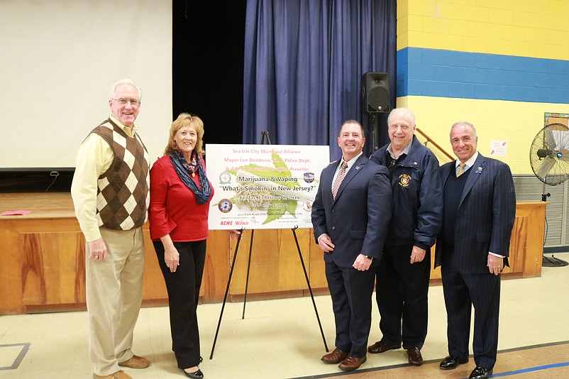 Cape May County Freeholders Jeffrey Pierson and E. Marie Hayes with retired DEA Agent, the keynote speaker, Doug Collier, Freeholder and Mayor Leonard Desiderio and Freeholder Director Gerald Thornton pose for a photo.