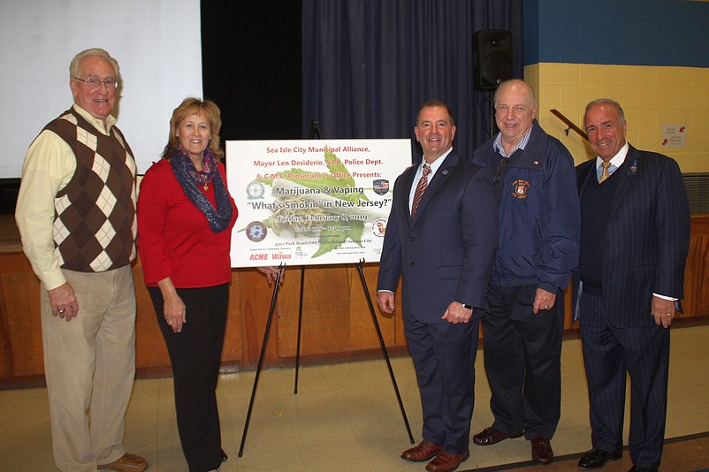 Keynote speaker Douglas Collier, center, is joined by Cape May County Freeholders Jeffrey Pierson, E. Marie Hayes, Gerald Thornton and Leonard Desiderio, who is also Sea Isle's mayor.