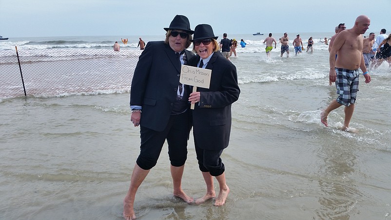 Cousins Mary Vogelman, 78, and Anne Dowling, 72, both of Mullica Township, Atlantic County, ham it up as the "Blues Brothers" movie characters during the 2019 plunge.