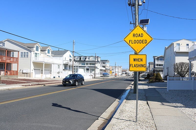 A new flood-warning system consists of 78 flashing road signs placed around town.