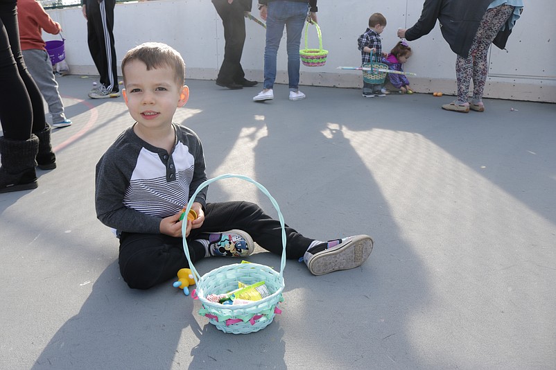 Asher McIver, 3, of Upper Township, sees what is inside an egg.