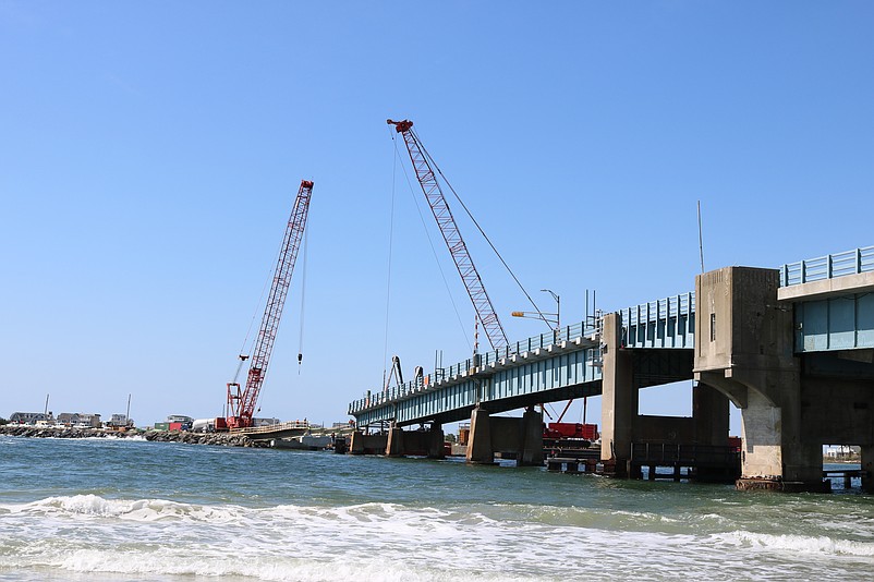 Giant construction cranes hover over the Townsends Inlet Bridge in 2019 for an $8.6 million repair project.