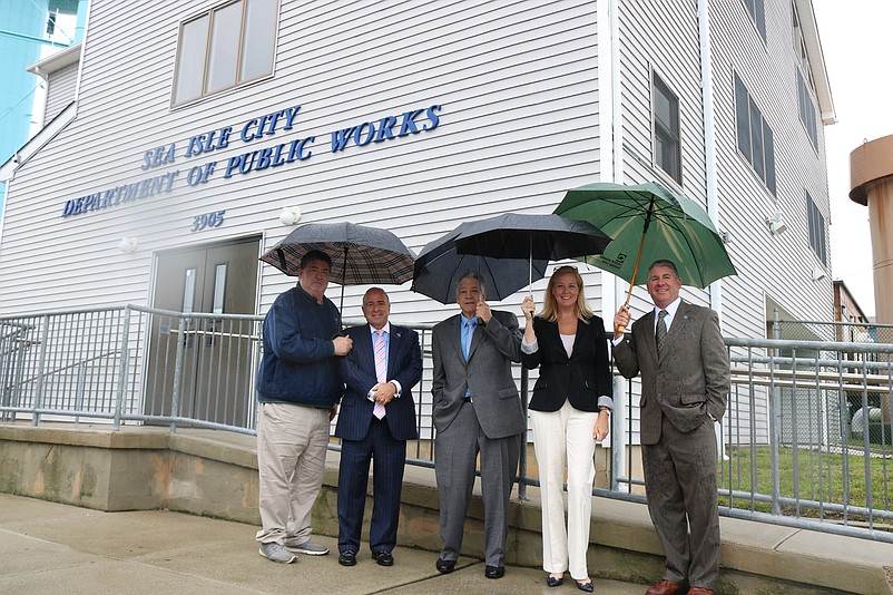 From left, Sea Isle Construction Official Neil Byrne, Mayor Leonard Desiderio, N.J. Coastal Coalition Executive Director Tom Quirk and OceanFirst Bank representatives Katherine Durante and Craig DeGenova stand in front of the city's Public Works Building, where the flood camera is located.