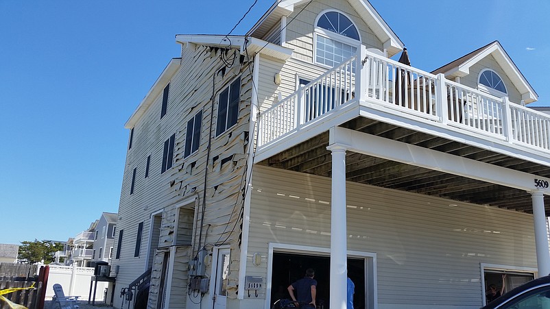 A neighboring home on Central Avenue sustained damage to the exterior from the fire's intense heat.