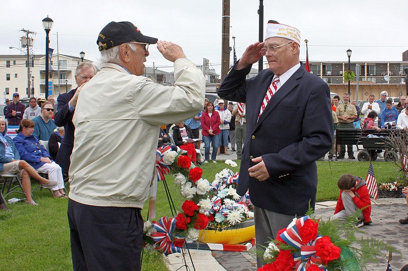 Shown saluting Veteran Leonard Desiderio Sr. (at left) during the wreath presentation at last year’s Memorial Day ceremony is VFW Post 1963 Commander Charles (Chick) Haines. (Photo courtesy City of Sea Isle City) 