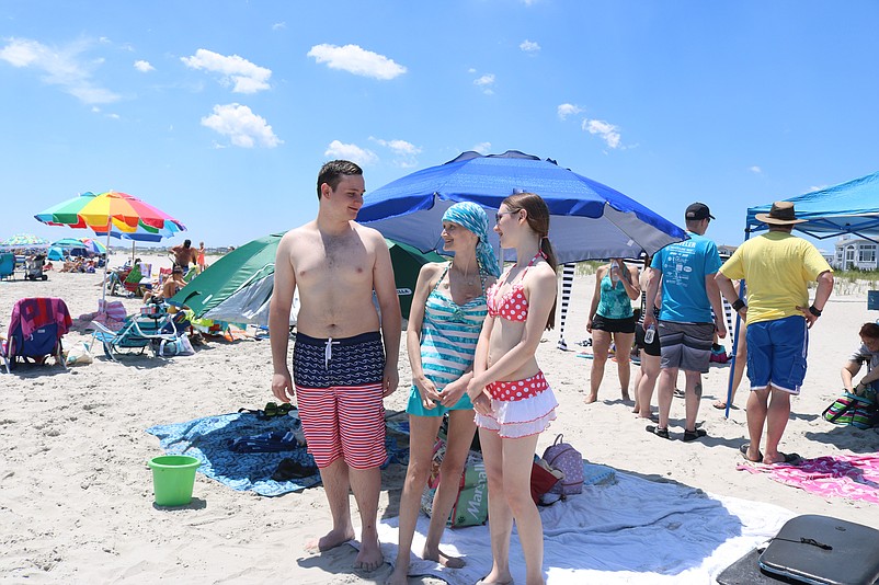 Cancer patient Tammy Grosso, center, relaxes on the beach with her son, Christian, and daughter, Amanda, during the For Pete's Sake outing in Sea Isle City in 2019.