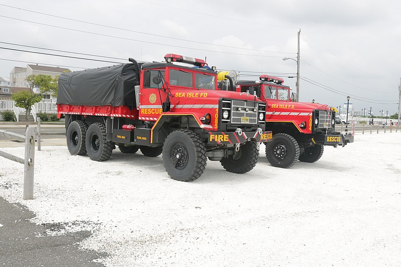 City vehicles, like these police department trucks, are parked on the property.