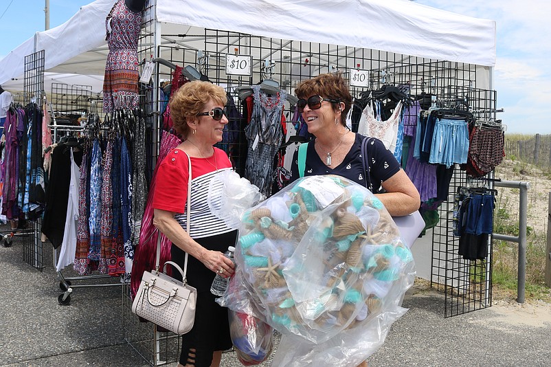 Mary Ann Christie, left, of Broomall, Pa., and Dot Murphy, of Sea Isle, each bought a wreath at the festival.