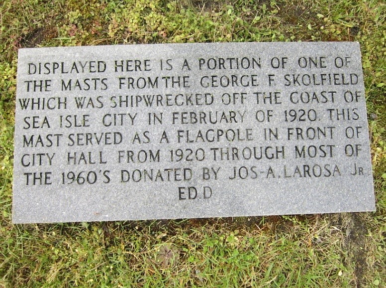 A plaque tells of how a mast salvaged from the George R. Skolfield became the flagpole at Sea Isle's old City Hall and later at the Sea Isle Historical Museum.