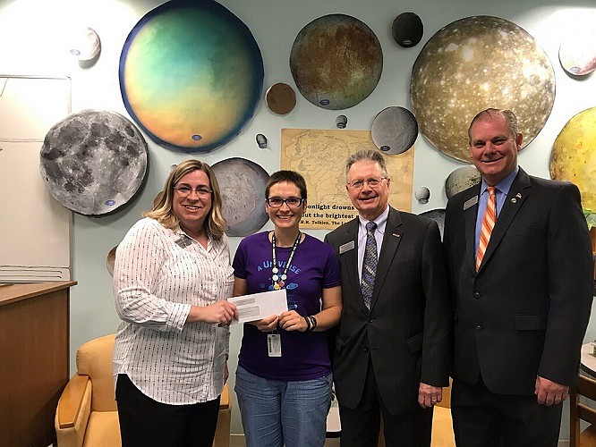 (L-R): Sturdy Savings Bank Cape May Court House Branch Manager Lisa Rendzak (left), presents the bank’s sponsorship check for the Cape May County Teen Photography Contest to Teen Services Librarian Johanna Boyle (center). Also pictured are Sturdy Savings Bank’s Business Development Officers Mike Lloyd and Michael Clark.