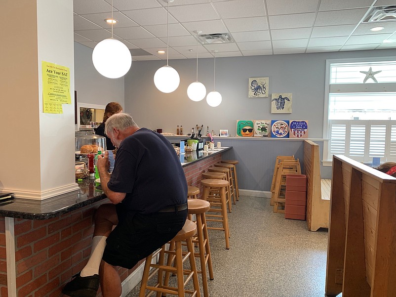 Customers can enjoy a cup of coffee or breakfast at the counter. 