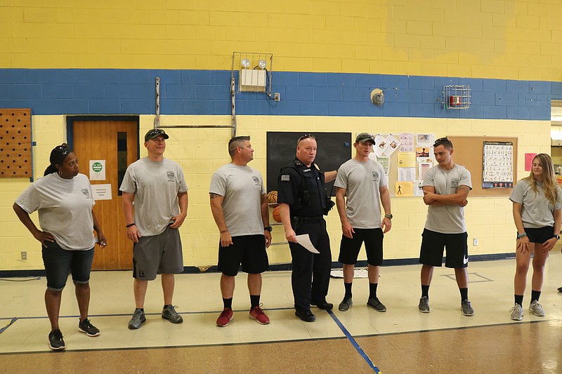 Police Chief Tom McQuillen introduces the officers to the campers.