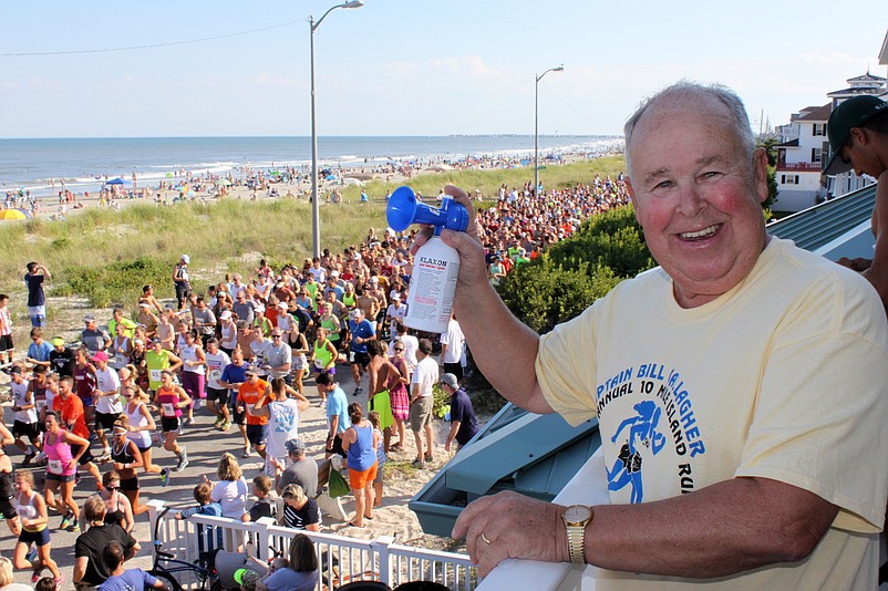 Former Beach Patrol Capt. Bill Gallagher is given the opportunity to sound the horn each year to start his namesake race.