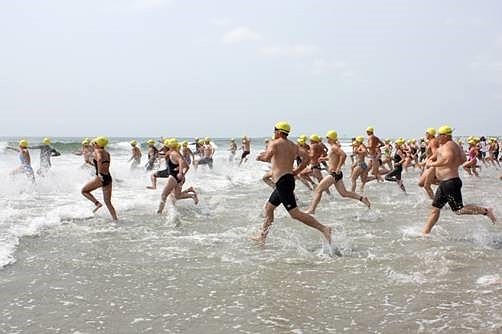 Competitors rush into the surf for the One-Mile Ocean Swim. (Photo courtesy Sea Isle City)