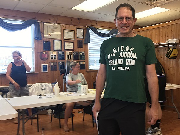 Dave Kolesar picked up his race number Saturday for the Captain Bill Gallagher Island Run sporting a 44-year-old T-shirt.