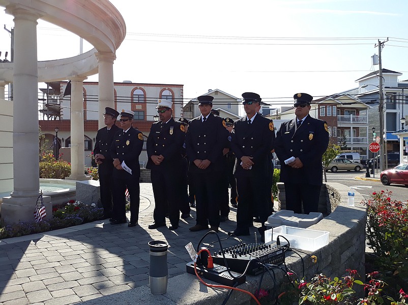 Members of the Sea Isle City police and fire departments stand at attention during the ceremony.