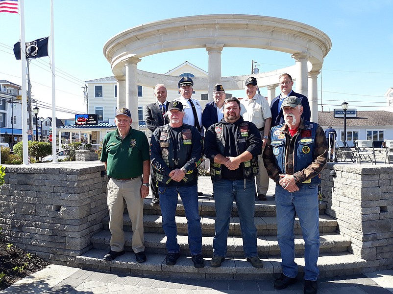 Local veterans join with elected officials from Cape May County at the monument at Sea Isle's Veterans Park.