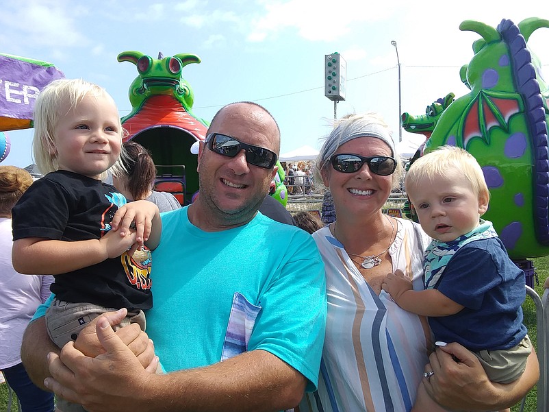 Jim Headdy, of Egg Harbor Township, his wife, Nicole Meuse, and their sons Aiden, 2, and 8-month-old Liam, head to the rides. 