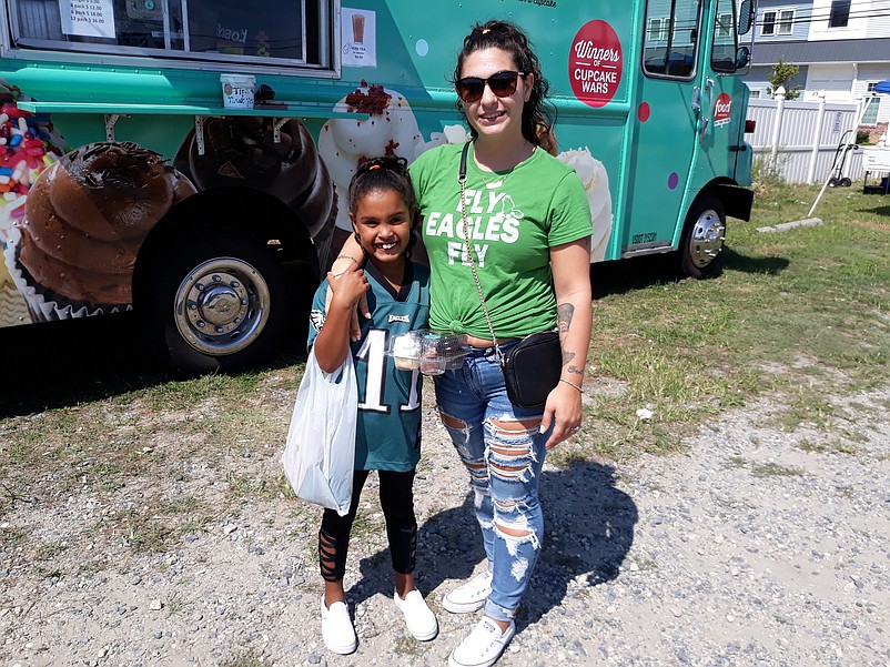 Angela Grosso, of Woodbine, and her 8-year-old daughter, Ma'kya Coleman, get ready to have cupcakes for dessert.