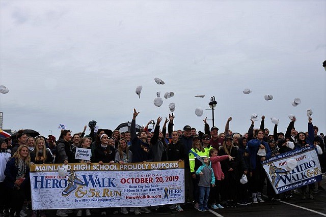  
 
Participants toss their caps in the air at the beginning of the walk.