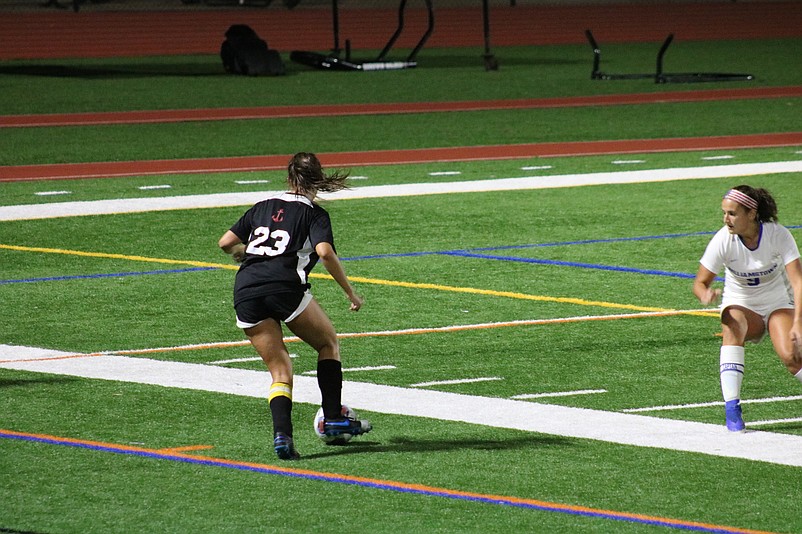 Ocean City senior Carly Reighard positions herself for a pass.