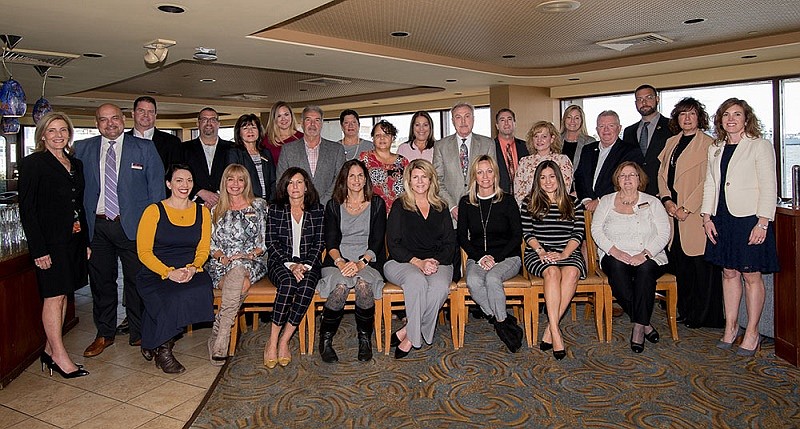 Carol Hopely Russo of Sea Isle City, standing, fifth from left, is among the leaders of Berkshire Hathaway HomeServices Fox &amp; Roach Realtors. (Photo courtesy of BHHS Fox &amp; Roach)