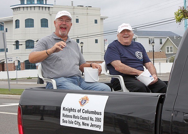 Members of St. Joseph’s Church’s chapter of the Knights of Columbus are involved in many activities, such as this light moment at the recent Columbus Day parade.
