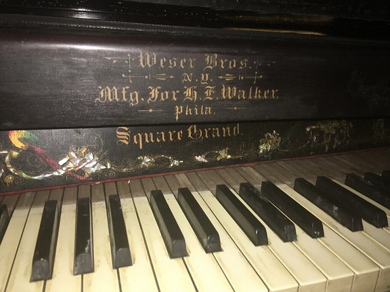 The old piano was made by Weser Bros. of New York, a company known for manufacturing high-end instruments.