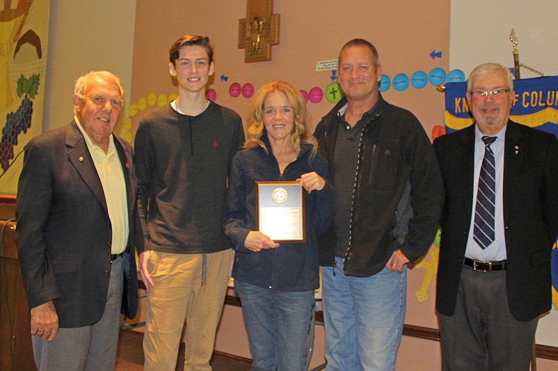 Knight Joe Koch, far left, presents the Catholic Student of the Year Award to Justin Klemick, of Ocean View, who unable to attend the ceremony because he is currently a freshman at Immaculata University studying physical therapy. Justin is a 2019 graduate of Wildwood Catholic High School.  Shown accepting the award on behalf of Justin are his brother, Shane, and parents, Kathleen and Ken. Also shown is Grand Knight Ed McFadden, far right.