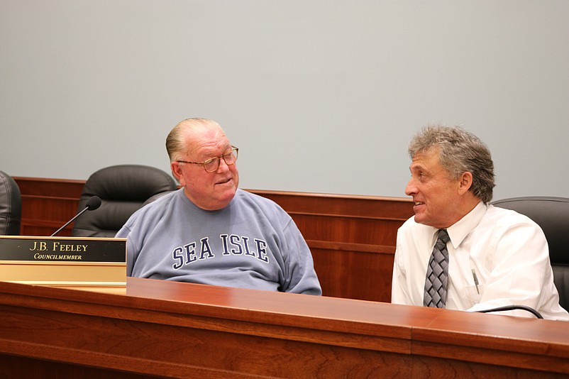 City Council President J.B. Feeley, left, and City Business Administrator discuss plans for a community recreation center that would not include an indoor swimming pool.