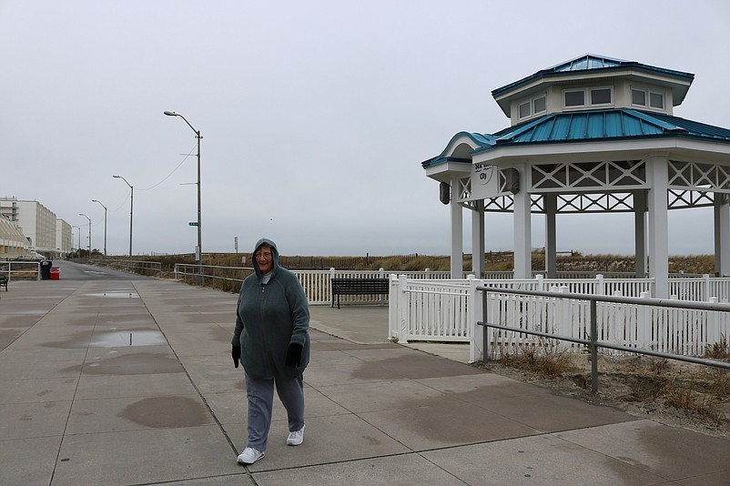 Sea Isle resident Martha Alexander has the Promenade virtually all to herself during a walk Sunday morning.