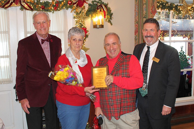 AARP 710 Volunteer of the Year, Sis Borden, with Mayor Leonard Desiderio, at right, at the Christmas luncheon in 2019. 